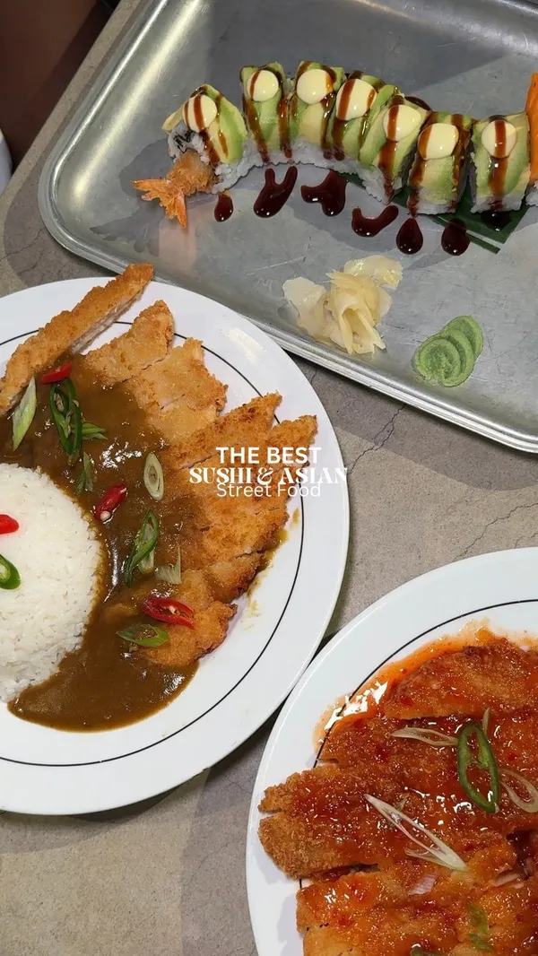The video showcases Inamo Sukoshi restaurant in Market Halls, Oxford Street, London. It features various Asian fusion dishes including Katsu Curry, Sweet Chilli Chicken, Dragon Roll Sushi, and a new summer sushi called 'Fruitomaki' (with strawberries and kiwi).  The drinks include an Aloe Vera juice in passion fruit and peach. The presentation emphasizes colorful plating and visually appealing food arrangements. No specific dietary information is given. The main focus is on the food and drinks, highlighting the vibrant colors and flavors.