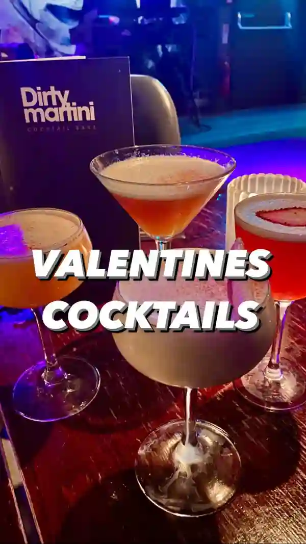 The video showcases Valentine's Day cocktails at the Dirty Martini bar. It features four signature cocktails: Pillow Talk, Love Affair, Strawberry Kiss, and L'Amour. The cocktails are presented in elegant glassware, with garnishes like strawberries and chocolate. The video highlights the bar's ambiance, including its interior design and lighting.  The main focus is on promoting the Valentine's Day cocktail offer with a special price.