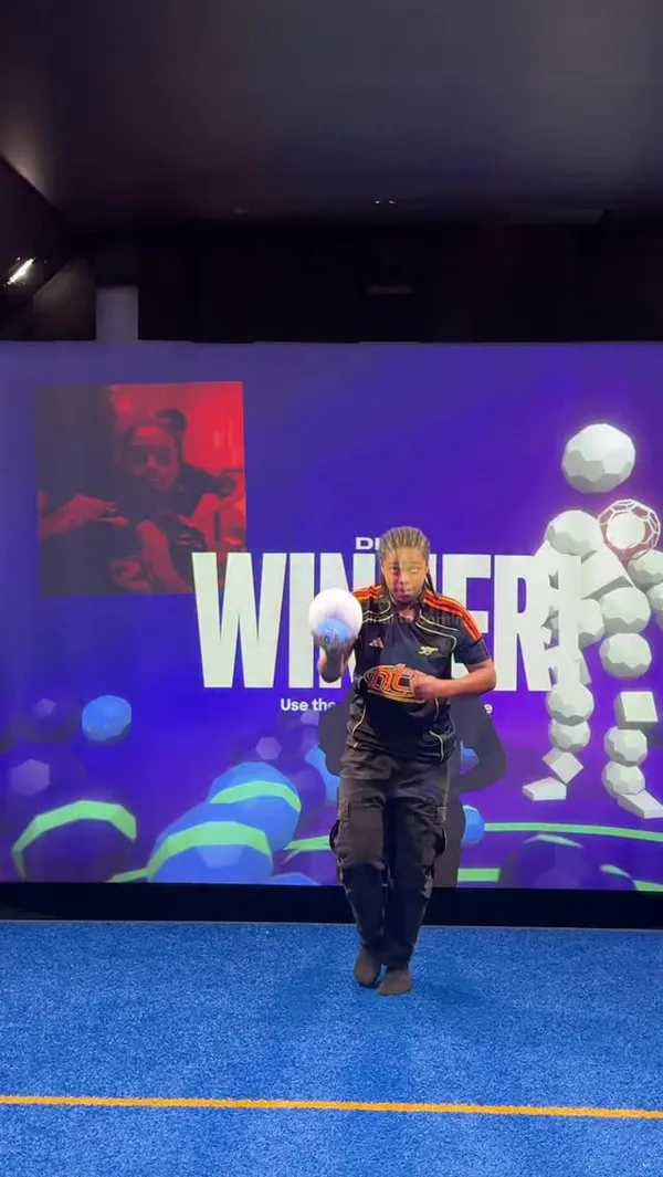 A group of friends visits Toca Social, an interactive football entertainment venue. The video showcases them playing various digital football games, drinking festive-themed cocktails, and enjoying a meal. The food featured includes a turkey burger with cheese and lettuce, served with fries and coleslaw, and glossy cranberry and hoisin chicken wings. The atmosphere is portrayed as energetic, fun, and festive.