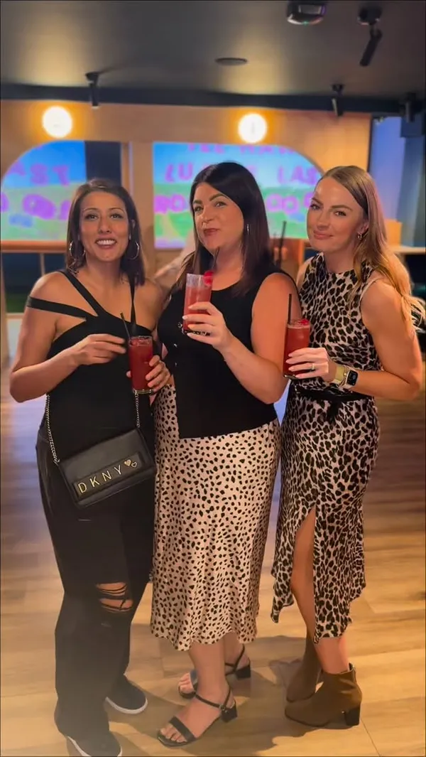 A group of friends celebrates a birthday at Clays Birmingham, participating in a virtual clay target shooting experience while enjoying pizza and loaded fries. The video captures the competitive and social nature of the venue, highlighting the food, drinks, and the activity itself.