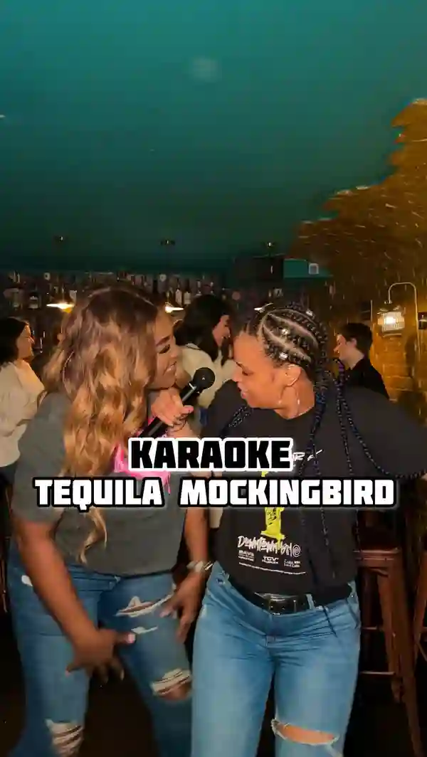 This video showcases a karaoke night at Tequila Mockingbird, a bar located in London.  It features various cocktails, including margaritas and shots, and highlights the bar's ambiance and staff. The main focus is the karaoke event, showing multiple people singing and enjoying themselves. The drinks are presented in various glasses, and the overall vibe of the video is fun and energetic. No specific dietary information is provided.