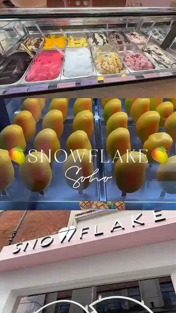 The video showcases Snowflake Soho, a cafe in London. It highlights their mango stix (mango sorbet in a white chocolate and lemon shell), various gelato flavors, and other dessert items. The presentation focuses on close-ups of the desserts, with a pink and marble aesthetic throughout the cafe.