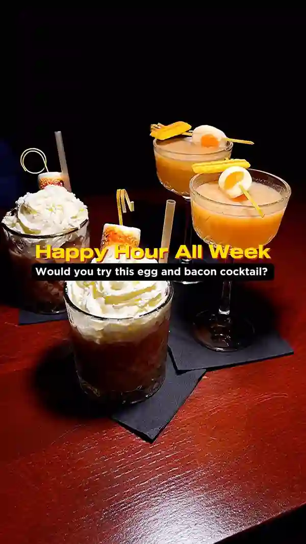 The video showcases various cocktails at The Cocktail Club bars in several UK cities. Cocktails include an egg and bacon cocktail, Truffletini, Southside Royale, Picante, Chocktails and dreams (with toasted marshmallow), and Cravat (with pineapple). The video emphasizes happy hour deals, highlighting the bar's ambiance with dim lighting and decorative elements.  Dietary information is not explicitly mentioned.