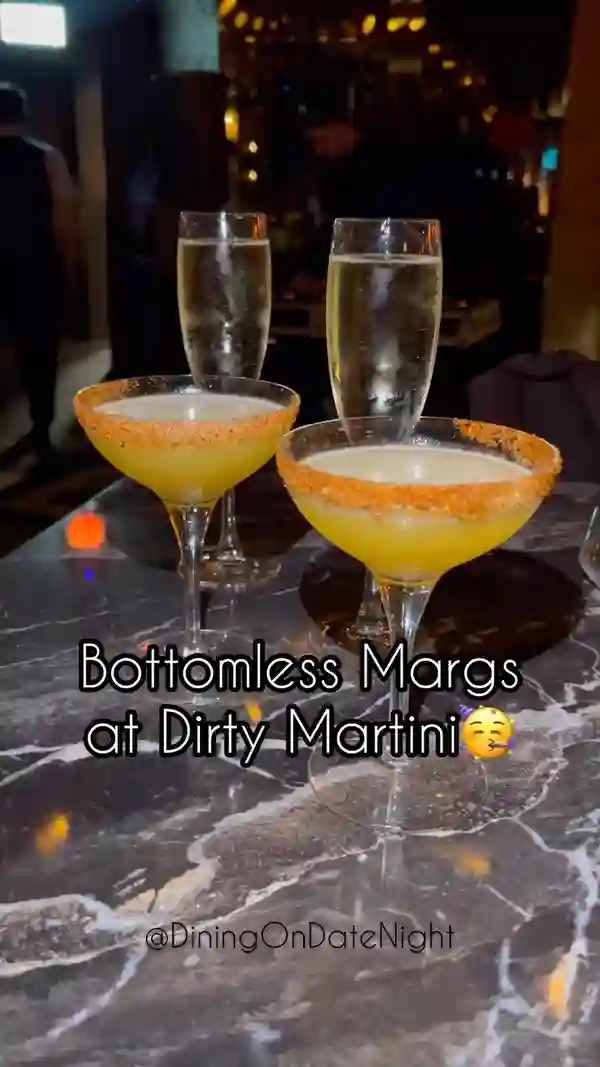 This video showcases a brunch experience at Dirty Martini, featuring a 90-minute free-flowing drinks package (margaritas, Prosecco, martinis, gin and tonics, or beer) and a Fiesta Food sharing board. The video highlights the speed of drink service and the quality of the margaritas and Prosecco. Food items shown include various sliders, nachos with different toppings (guacamole, salsa), and chicken skewers. The presentation is visually appealing, with close-ups of food and drinks. No specific dietary information is provided. The main focus is on the experience of the brunch.