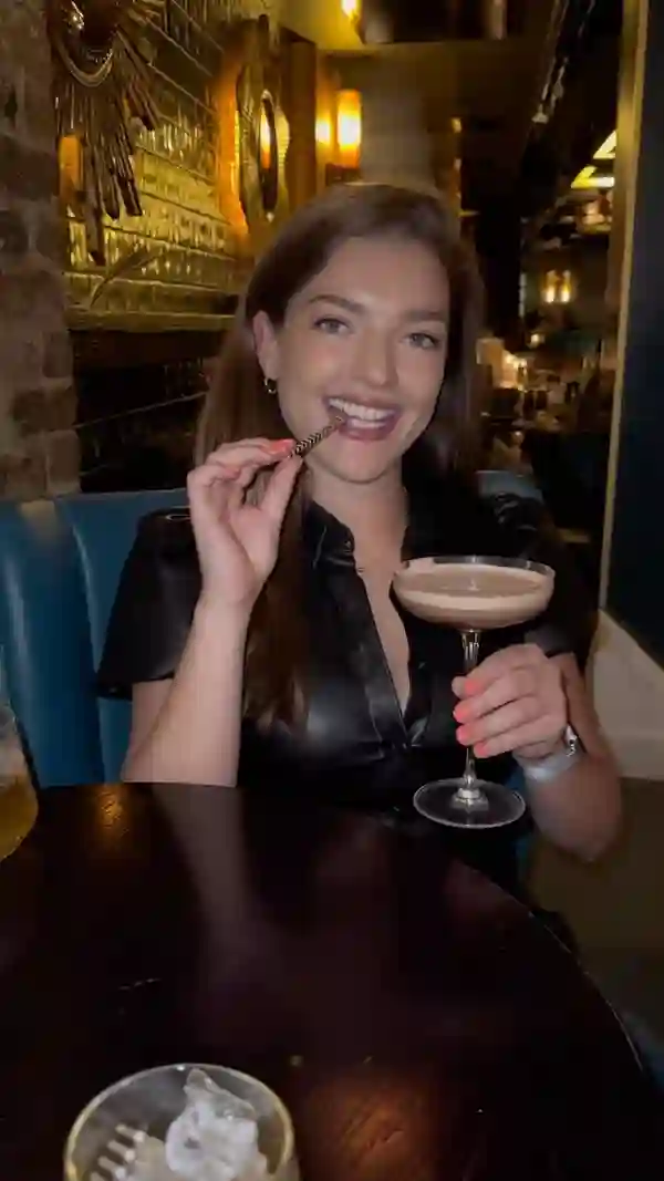 The video showcases three limited-edition chocolate cocktails at the Dirty Martini bar in London.  The cocktails are presented in martini glasses and rocks glasses; the visual style is sleek, dark, and sophisticated. The video shows a woman enjoying one of the cocktails, then transitions to shots of the cocktails being made and finally shows all three cocktails on a table.  The cocktails shown are: choco-rum-tini, cacao old fashioned, and mocha-licious. No dietary information is provided.