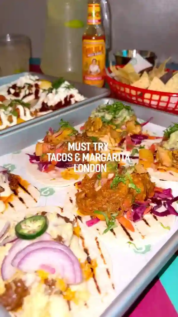 This video showcases a meal deal from Barrio Bars in London, featuring 8 tacos, a large margarita jug, and guacamole with chips.  Various taco fillings are shown, including beef, prawns, and a fried egg option. The video highlights the price (£45 for the deal) and the option to add extra tacos for £2 each.  The vibrant atmosphere of the restaurant is also shown, emphasizing the fun and social aspect of the dining experience. The video emphasizes the variety and deliciousness of the food and drink.