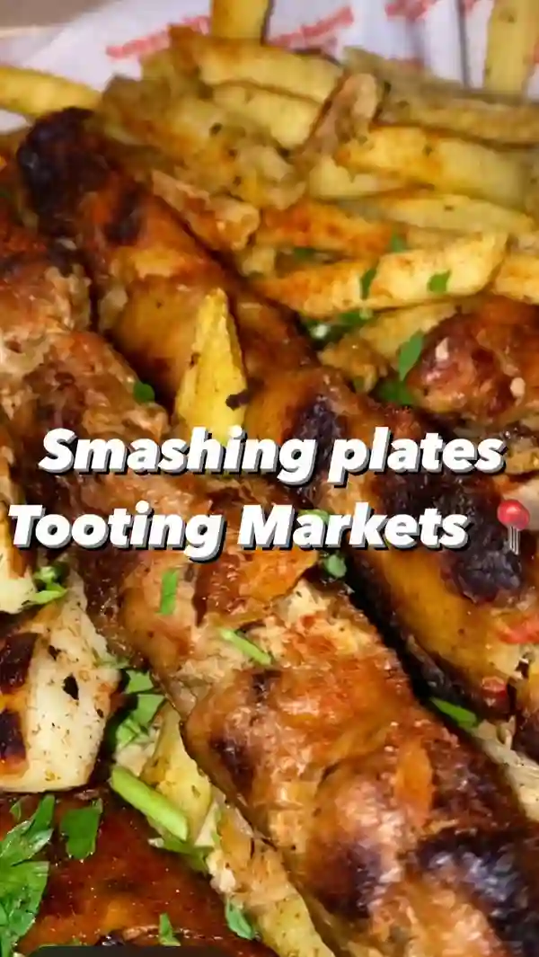 The video showcases a meal at Smashing Plates, a Greek restaurant in London. The food presented includes a large sharing plate with kofta, sausage, shredded chicken, halloumi, and fries; a gyro with chicken, fries, and salad; and a cinnamon-sugar dessert. The focus is on the generous portion sizes and the influencer's enthusiastic enjoyment of the food.  No dietary information is explicitly given.