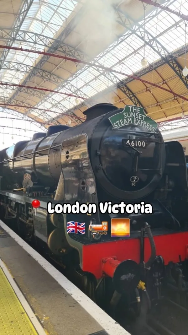 The video showcases a dining experience aboard a historic steam train in London.  The setting is a vintage train carriage with plush seating. The food shown includes a plated main course (beef with asparagus and mashed potatoes), and an apple dessert with custard and orange sauce. The presentation is elegant, formal dining style.  No dietary information is explicitly provided. The main focus is on highlighting the unique and luxurious experience of a steam train journey combined with fine dining.
