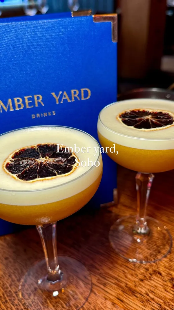 The video showcases Ember Yard, a Spanish and Italian-inspired restaurant in Soho, London. It highlights various dishes from their chef's tasting menu, including prawns pil pil, yellowfin tuna, grilled presa, and a dessert mille-feuille.  The presentation emphasizes vibrant colors and close-ups of the food's textures.  The video also shows the restaurant's interior and cocktails.