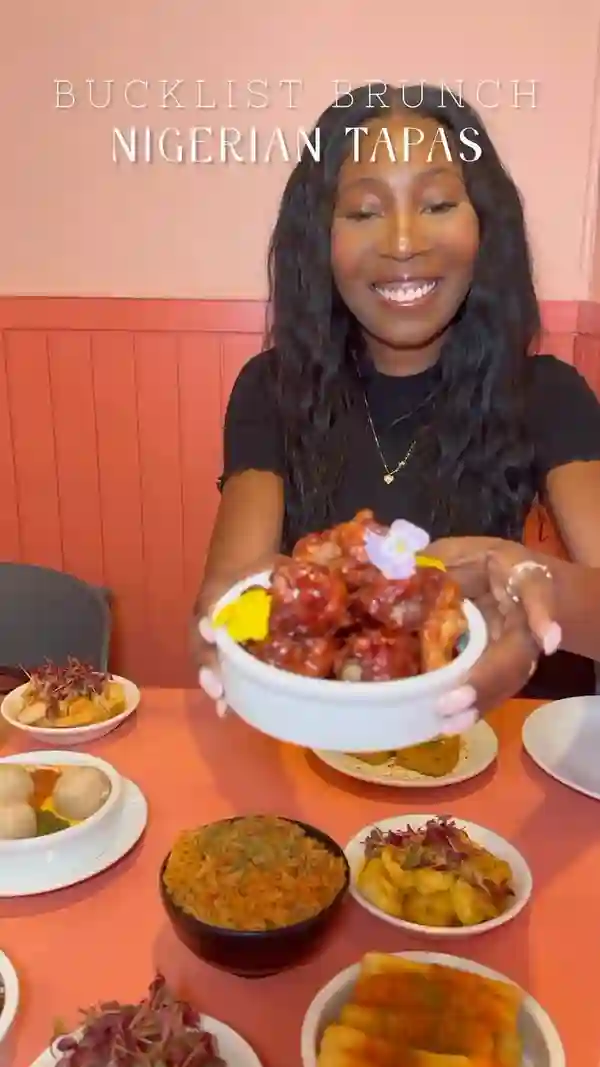 This video showcases Chuku's, a Nigerian tapas restaurant in Tottenham, London. It features various brunch dishes, including Caramel Kuli Kuli wings, Jollof rice, Moi Moi, Cassava with Ata Din Din, Honey Suya prawns, Lamb Ayamase, Zobo wings, an Egusi bowl, Chin Chin cheesecake, and Yam brownie. The food is presented in a visually appealing manner, with close-up shots emphasizing textures and colors. Dietary information is provided, mentioning gluten-free and vegan options. The video's main focus is on showcasing the food and the overall dining experience.