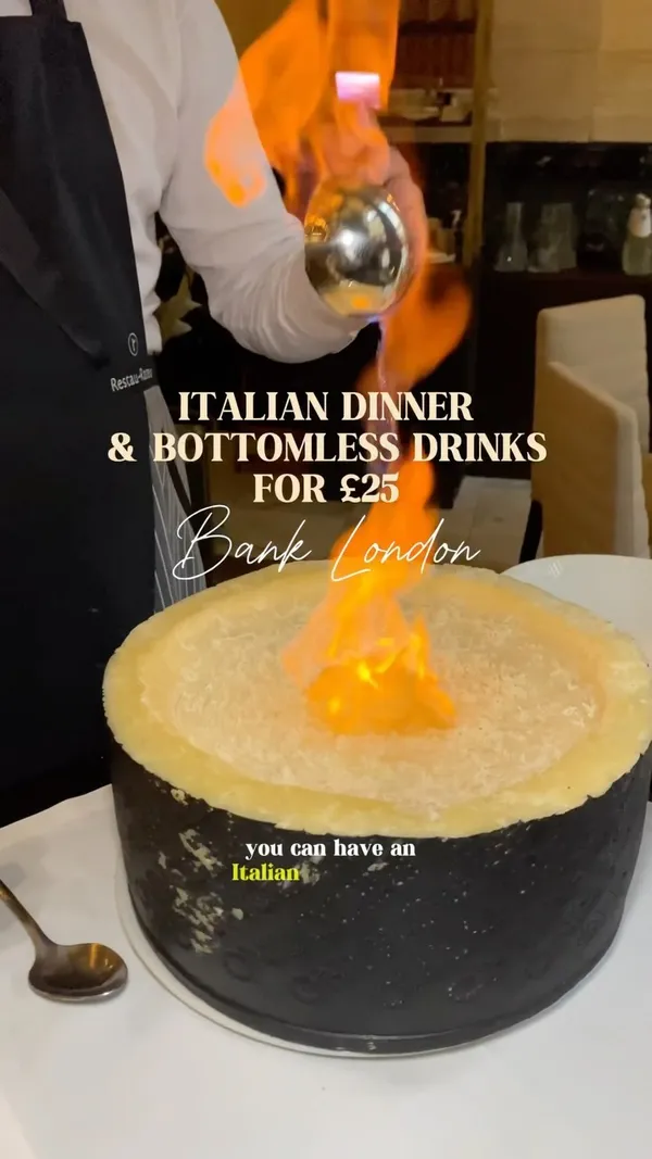 The video showcases Piazza Italian Restaurant in London, highlighting their Italian dinner and bottomless drinks deal for £25. It features various dishes including lobster linguine, veal with tuna sauce, truffle spaghetti, and unique desserts like a signature tomato dish and pistachio passionfruit roll. The restaurant's grand interior, located in a former bank, is also shown.