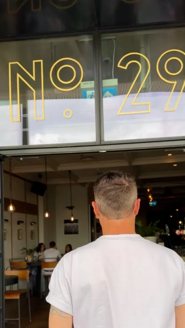 The video showcases a Sunday roast meal at No. 29 Power Station West restaurant in London. It features various dishes, including meatballs in a tomato-based sauce, pea puree, roast chicken with Yorkshire pudding, roast potatoes, gravy, and green beans.  The dessert appears to be a crème brûlée. The presentation is clean and visually appealing, focusing on close-ups of food items and overhead shots of the meal setting. No specific dietary information is provided.