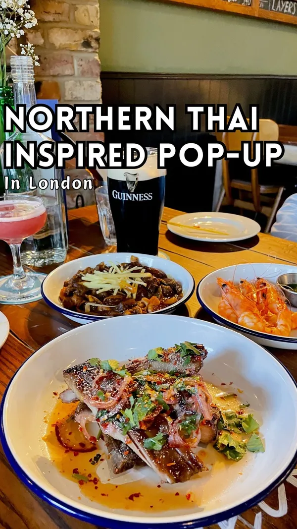 The video showcases a pop-up event at The King & Co. pub in London, where Chef Paul from Rice Paddy is offering a Northern Thai-inspired menu.  The video highlights various dishes, including Chiang Mai fried chicken, smoked whiskey ribs, king prawns with green nam jim, and oyster mushroom satay. The food is presented in visually appealing ways with overhead and close-up shots, emphasizing textures and colors. No specific dietary information is provided.