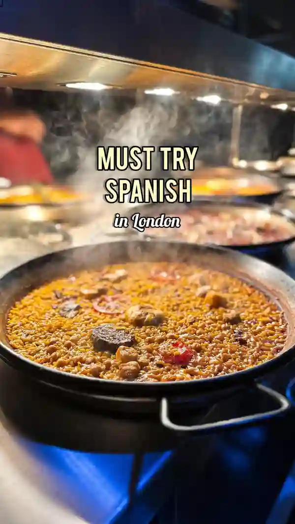 The video showcases Arros QD, a Spanish restaurant in London's Soho. It highlights their wood-fired paellas (various seafood and meat options), fresh burrata-filled pani puri, and Iberian pork. The video emphasizes the restaurant's ambiance and the preparation of paella in their open kitchen.