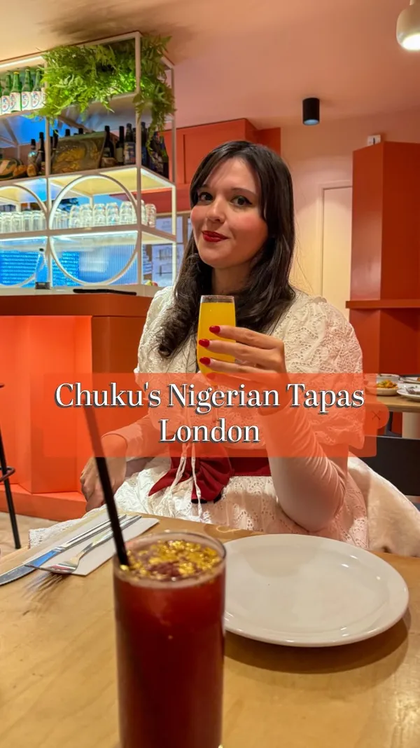This video showcases a meal at Chuku's Nigerian Tapas restaurant in London.  The video features various Nigerian tapas dishes, including Smoked Turkey Meat Pie, Moi Moi, Jollof Rice, Egusi Bowl, Caramel Kuli Kuli Wings, Honey Suya Prawns, and a Puff Puff Rum Baba dessert. The food is presented attractively on plates and bowls, emphasizing the visual appeal of each dish.  The main focus is on the food and the overall dining experience. No dietary information is explicitly provided.