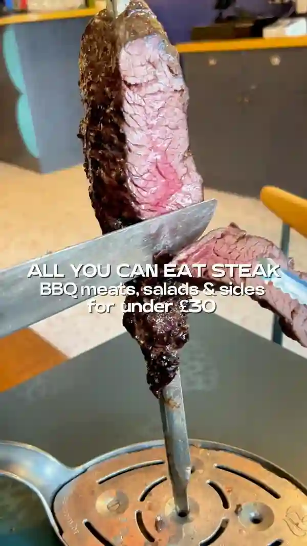 This video showcases Preto Restaurant, specifically their new Angel branch.  The video highlights their all-you-can-eat rodizio grill offer, featuring various BBQ meats (steak, chicken wings, sausages, ribs), salads, Brazilian sides (rice, beans), and desserts (passion fruit cake and caramel cheesecake).  The food is presented on skewers, plates, and in bowls. The presentation emphasizes the variety and abundance of food. No specific dietary information is provided. The video mainly focuses on a meal showcase.