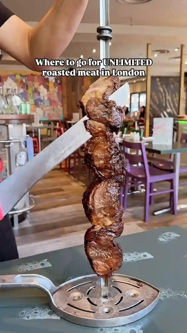 The video showcases Preto Brazilian Steakhouse in London, highlighting their all-you-can-eat Rodizio grill experience.  Various grilled meats are presented, along with a buffet featuring Brazilian hot dishes such as rice, beans, and salads. Mocktails and traditional Brazilian desserts like Brigadeiro and Pudim are also featured. The main focus is on the restaurant's food and dining experience.