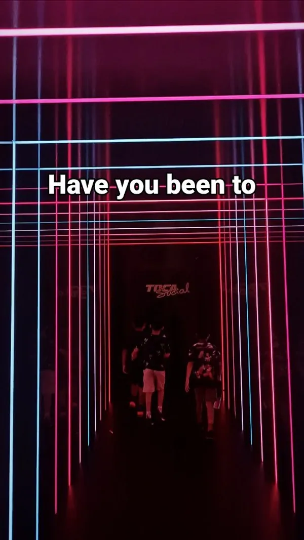 The video showcases Toca Social, a venue at The O2 in London, featuring interactive football games.  It highlights various game options and the venue's atmosphere, including a bar area where food and drinks are available.  No specific food or drinks are shown, but the presence of a bar and menu suggests standard bar fare.