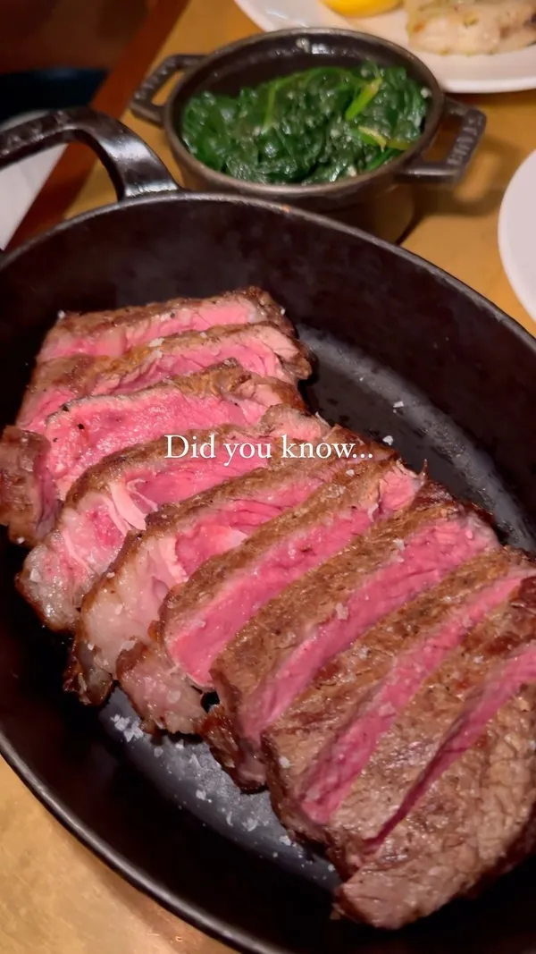 The video showcases a meal at Hawksmoor restaurant in Canary Wharf, London.  It features various dishes including oysters, bone marrow, steak with sauce, grilled sole, and macaroni and cheese. The food is presented in a visually appealing manner with good lighting and close-up shots. No dietary information is explicitly provided. The primary focus is on showcasing the quality of the food and ambiance of the restaurant.
