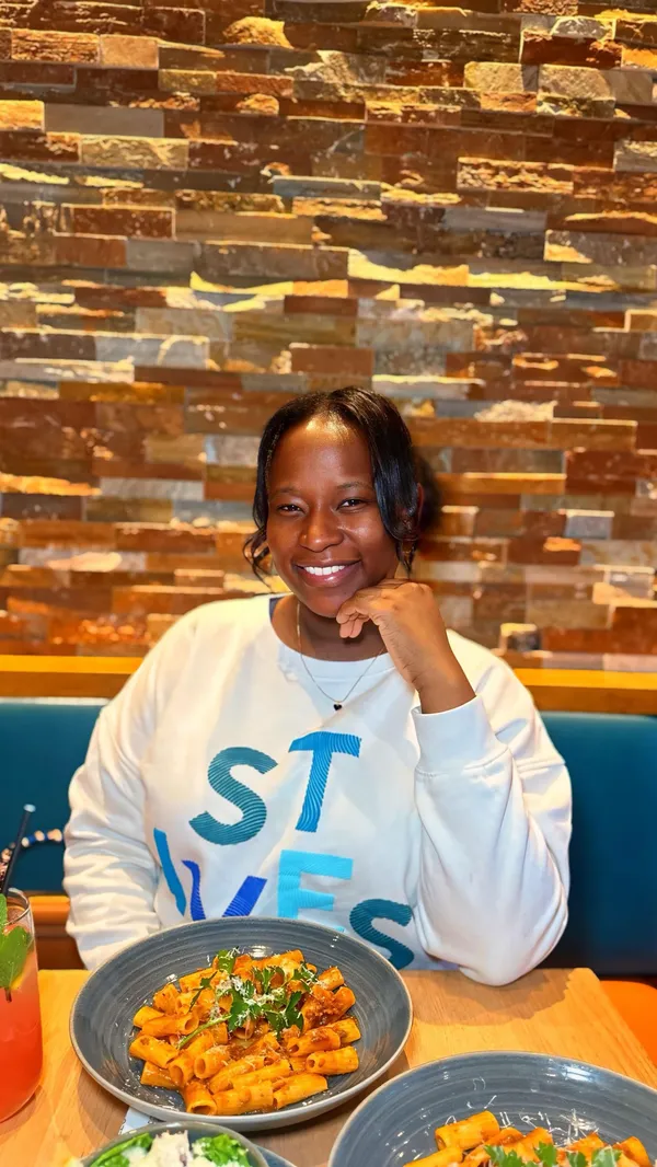 This video promotes Prezzo, an Italian restaurant, highlighting their family meal deal available every Monday from 3 PM until closing. The video showcases the restaurant's interior, including a pizza oven, and features a family enjoying a meal together. The food shown includes garlic bread, rigatoni with bolognese sauce, salad, fries, and a sharing sundae. The presentation emphasizes the family-friendly atmosphere and the variety of dishes available. The main focus is on the family meal deal, which includes a family-sized garlic bread, a family-sized portion of pasta (rigatoni, pomodoro, bolognese, pesto, or carbonara), and the option to add sides for £8 for two, and a sharing sundae for £9.95.