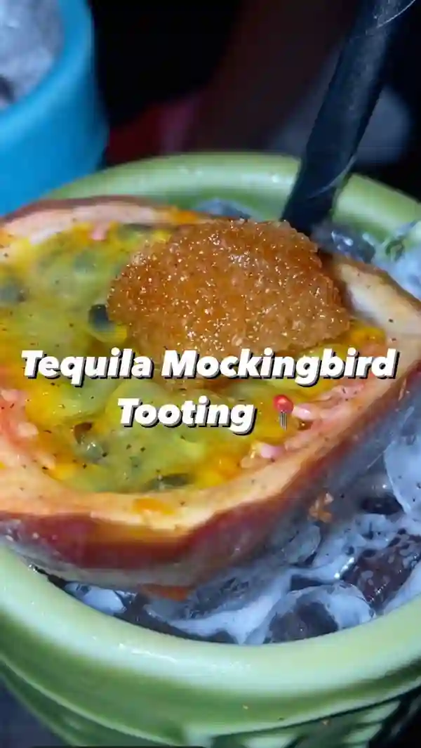 The video showcases Tequila Mockingbird, a bar in Tooting, London. It highlights the bar's atmosphere, cocktail menu (featuring 22 new cocktails), and happy hour. The focus is on a girls' night out, with various cocktails featured, including the Tequila Zombie, described as sour and strong. The presentation includes shots of the bar's interior, cocktails being prepared (including flaming ones), and close-ups of the drinks. No specific dietary information is provided.