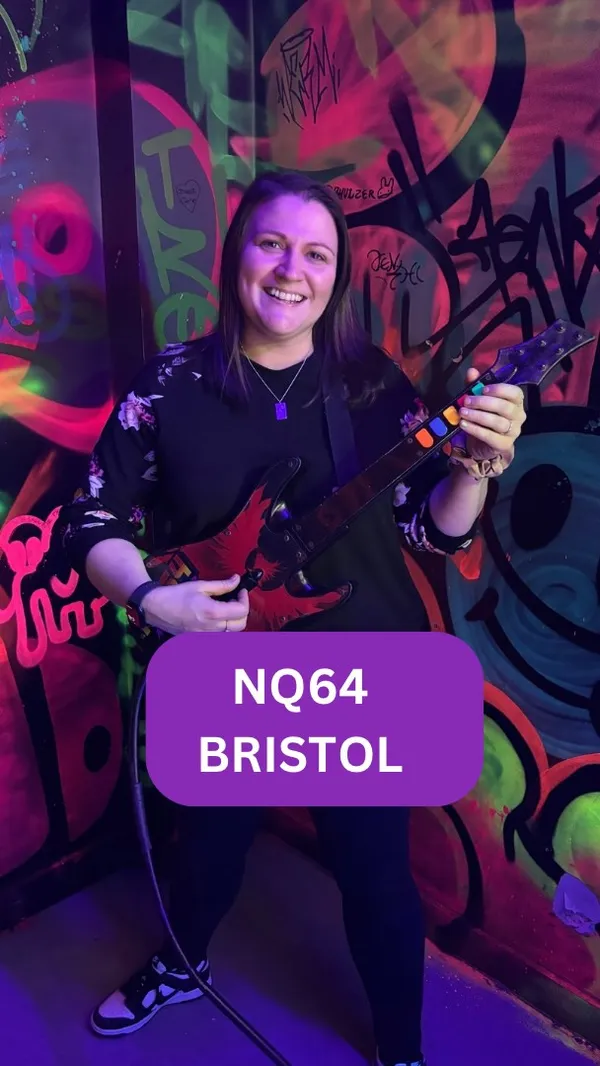 The video showcases NQ64 arcade bar in Bristol. It features a person playing Dance Dance Revolution, followed by shots of two women smiling, a cocktail menu, and various cocktails including Mountain Doom and Quick Revive #5. The video then shows gameplay of a racing arcade game, Point Blank 2, and basketball arcade game. The video also shows the person drinking Quick Revive #5, playing Guitar Hero, and Pac-Man. The video ends with a shot of the bar's interior and address.