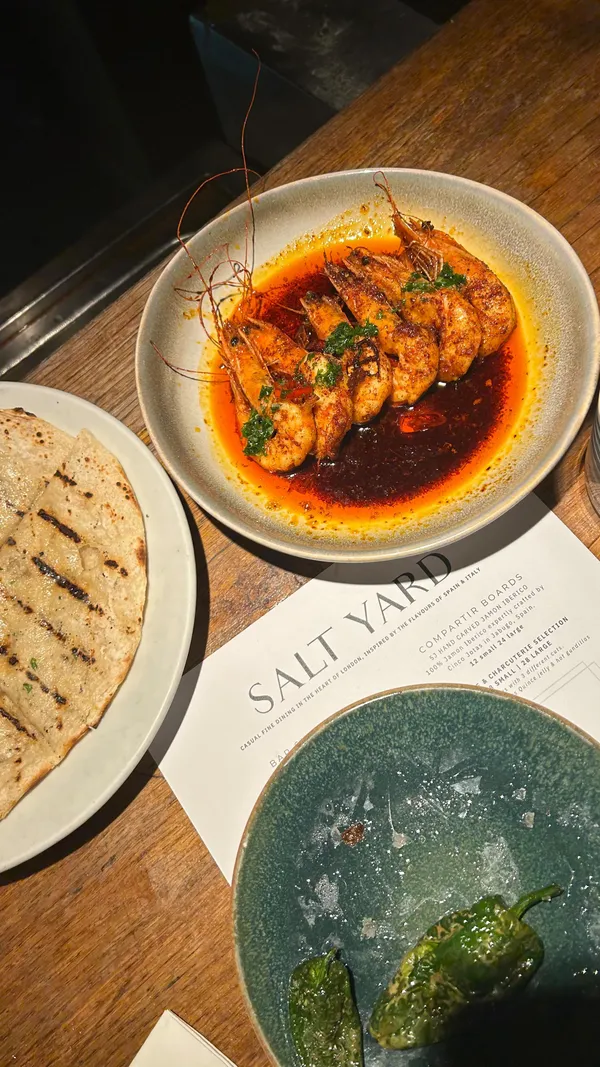Saturday night at Salt Yard in Fitzrovia was a fabulous experience for any food lover in London! 👯‍♀️⭐️

We opted for the head chef’s tasting menu, a perfect blend of Spanish tapas and Italian cuisine. From the creamy nocarella olives and charred padron peppers to rich chorizo, tender cuttlefish, and the best duck I’ve ever tasted, every dish was a DELIGHT. The gambas pil pil a hit at the table, and the truffle arancini is an absolute must-try🦐♥️

At just £45, the tasting menu offers incredible value for dining in central London. We left completely stuffed & satisfied! The cocktails were also top-notch, and while the wine list is a bit more expensive, it’s perfect for a special occasion🍷

With its casual fine dining atmosphere, Salt Yard is perfect for a Saturday night out in London, a date night, or catching up with friends. And if you’ve never explored north of Tottenham Court Road, it’s full of hidden gems, cozy pubs, and great spots like Salt Yard. 

I’ll definitely be back to discover more of the area!🫡

#londonfoodie #tastingmenu #tapasbar #londonhiddengems *partially gifted*