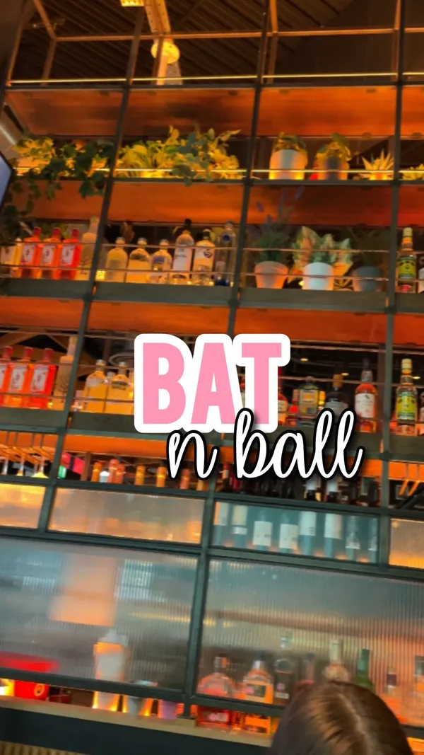 This video showcases Bat N Ball, a bar and entertainment venue in Westfield Stratford, London.  The video features various food items, including a margherita pizza, chicken strips, and a lucky fried chicken burger, along with cocktails such as a Pornstar Martini and Mojito.  The presentation focuses on the food's visual appeal, highlighting its colors and textures. There is no explicit mention of dietary options, though the food appears to be typical pub fare.  The video's primary focus is on the food and drink experience, with a secondary focus on the ping pong facilities.