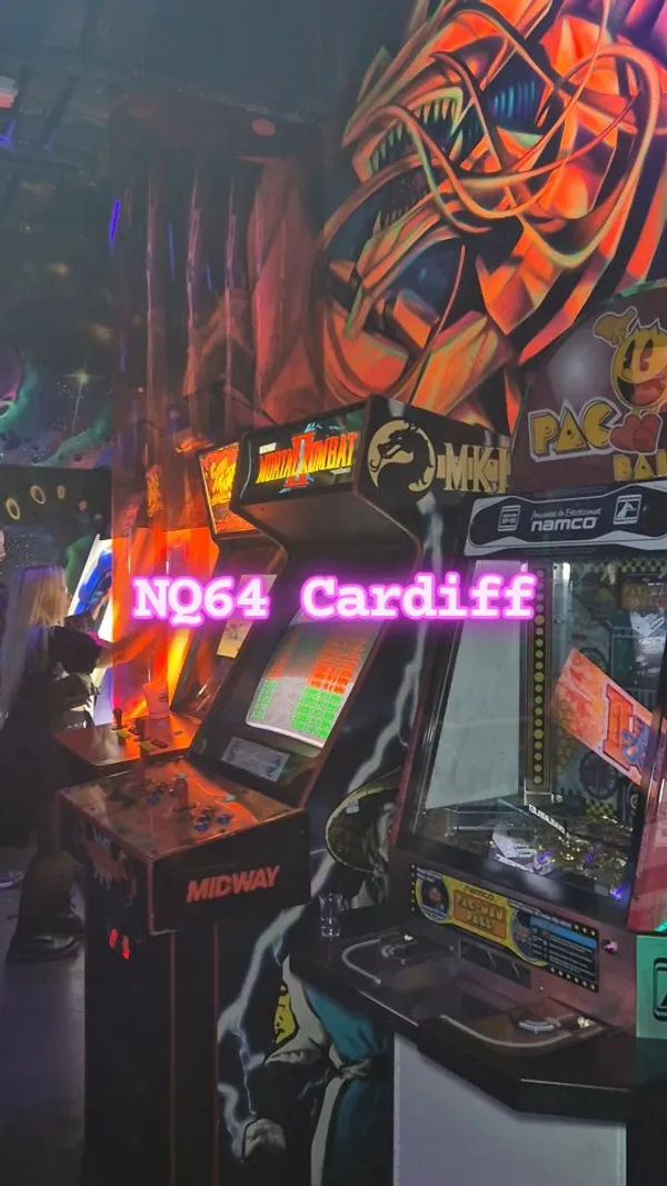 This video showcases NQ64, an arcade bar in Cardiff. It features various arcade games, including Mortal Kombat II, Dance Dance Revolution, and Guitar Hero.  The video also highlights the bar's cocktail creations, showing the preparation of several themed drinks, including one that is flambéed. The cocktails are presented in unique, retro-themed glassware. No specific dietary information is provided.