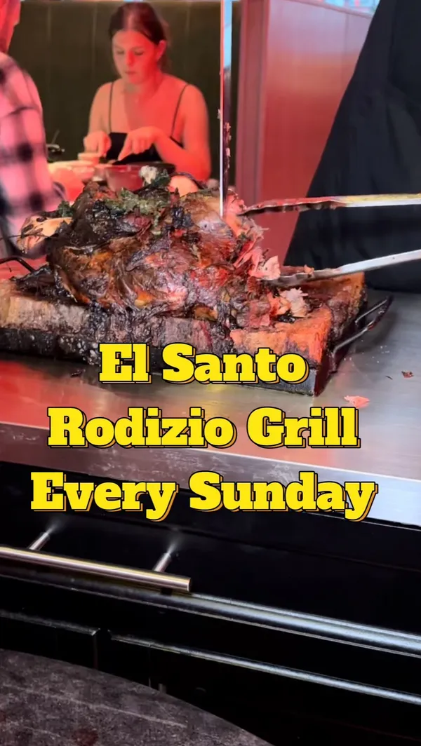 This video showcases El Santo restaurant in Glasgow, Scotland, which offers an unlimited Rodizio grill every Sunday for £38.95 per person. The video highlights various meat options (including lamb chops, beef, chicken hearts, and chicken wings), alongside unlimited sides like Brazilian cheese bread, chips, rice, beans, and various sauces. The presenter emphasizes the quality of the food, the friendly service, and the unlimited nature of the offering. The video also shows the use of green/red cards to signal whether the customer wants more meat.
