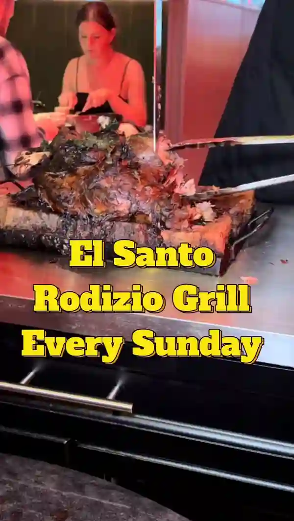 This video showcases El Santo restaurant in Glasgow, Scotland, which offers an unlimited Rodizio grill every Sunday for £38.95 per person.  The video highlights various meat options (including lamb chops, beef, chicken hearts, and chicken wings), alongside unlimited sides like Brazilian cheese bread, chips, rice, beans, and various sauces.  The presenter emphasizes the quality of the food, the friendly service, and the unlimited nature of the offering.  The video also shows the use of green/red cards to signal whether the customer wants more meat.