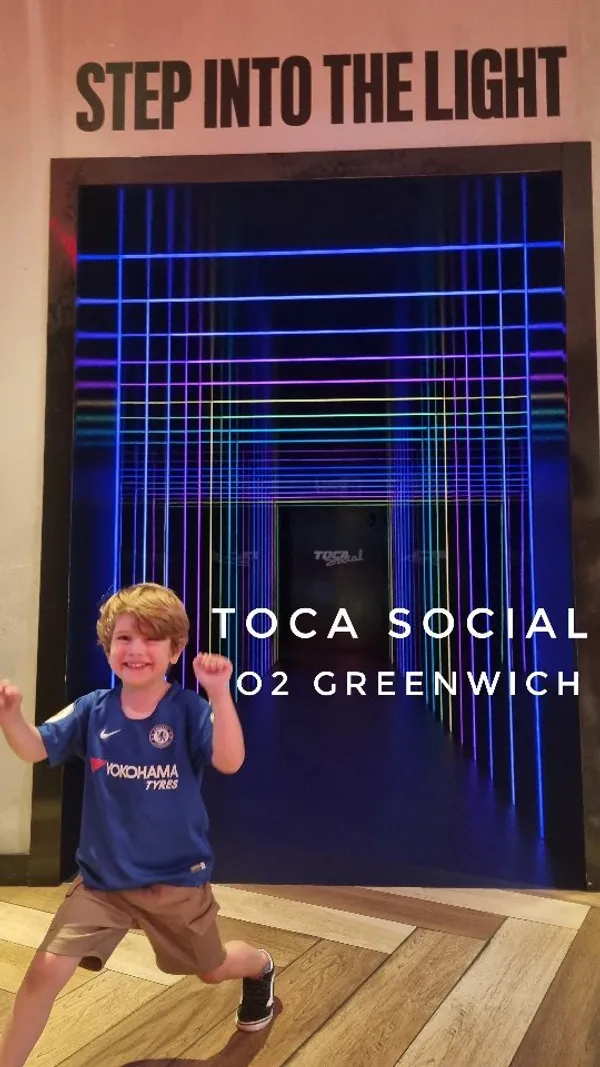 The video showcases TOCA Social, a restaurant and entertainment venue at the O2 Greenwich, London.  It features various interactive football games, with players of all ages participating.  The menu includes Asian and American cuisine; a sample of the menu is shown.  The video emphasizes fun and family-friendly entertainment, with brief glimpses of food and drinks.