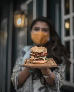 Vintage Alley cozy restaurant with vintage decor, featuring special pizza with thin crust, prawn sandwich, double patty chicken burger, chicken & beef burger, and refreshing apply mojita.
