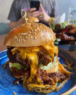Nation of Shopkeepers Leeds: The Boss and Big Cow burgers with cheese sauce, bacon, tobacco onions, plus Korean wings.