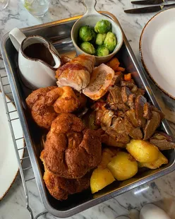 Festive roast dinner sharing platter at Culleys, Exchange Hotel, with braised Welsh beef, stuffed turkey, and Christmas trimmings.