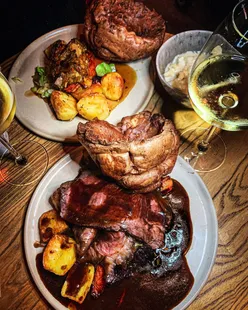 Nut roast and roast beef lunch at The Kings Arms, Woodstock, cozy pub with roaring fire, Yorkshire puddings, and dog-friendly atmosphere.