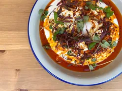 Turkish brunch at Longa Cafe: Menemen with sausage and Simit with egg on Whitchurch Rd, Cardiff, flavorful and delicious.