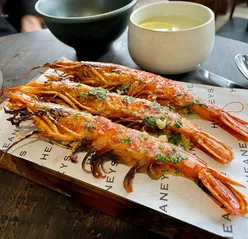 Seasoned garlic tiger prawns at Heaney's Restaurant, Pontcanna, Cardiff, with cozy atmosphere and top-class service.