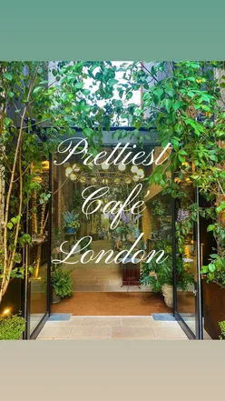 Cozy cafe scene at The Garden at the Lane, featuring quality coffee in a tranquil, garden-like ambiance.