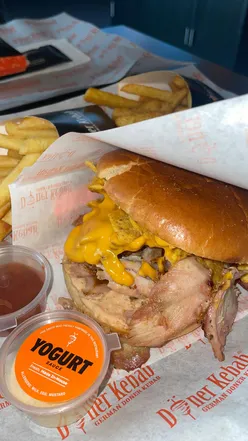 Delicious beef doner wrap, chicken burger with Doritos, and doner spring rolls at German Doner Kebab, Walsall.
