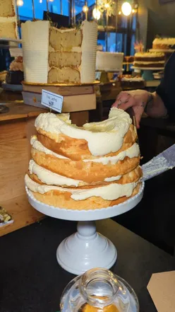 Charming Bristol cake shop with Diagon Alley vibes, showcasing delicious baked goods at Ahh Toots. Harry Potter theme.