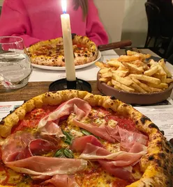 Woodfired pizza at The Dough Thrower, Canton: Los Pollos Americanos, Margherita with Serrano ham, and gourmet fries with parmigiano and truffle oil.