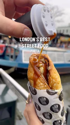 Yorkshire Burrito at Camden Market: Fluffy Yorkshire pudding filled with beef, chicken, or veggie cauli cheese, crispy potatoes, stuffing, and hot gravy.