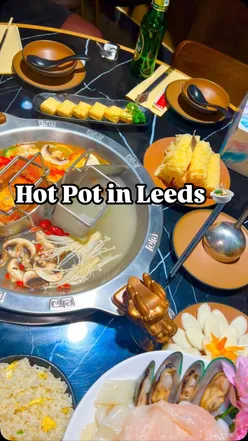 Delicious hot pot meal at Crown Hot Pot in Leeds, showcasing vibrant ingredients and a cozy dining atmosphere.