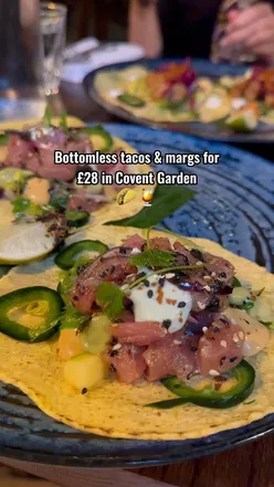 Hawaiian street-food tacos with Kalua pork, chicken annato, lamb barbacoa, roasted mushrooms, and ahi tuna poke at El Takoy London.