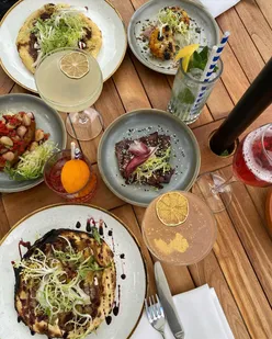 Small plates and flatbreads at Neigh Bar, Careys Manor, perfect for post-forest walk summer dining in Hampshire.