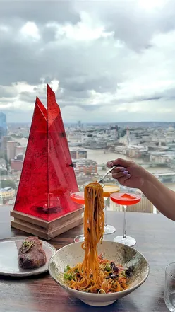 Oblix Restaurant lunch menu at The Shard: beef carpaccio, seared salmon, BBQ ribs, steak, seabream with Thames views.