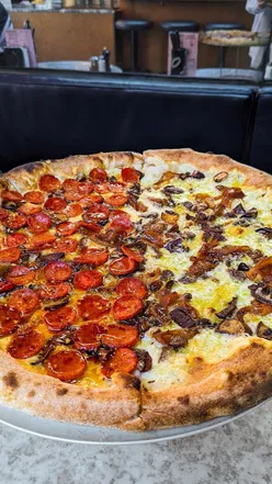 Delicious pepperoni pizza slice at Pizzucci Bristol, perfect for food lovers visiting Bristol.