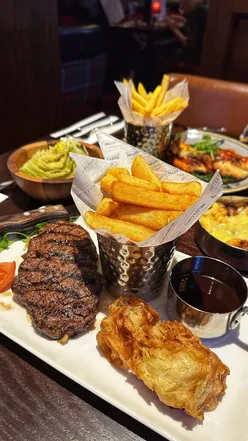 Perfectly cooked steaks with dessert cocktails and sides at Miller & Carter Middlewich steakhouse for a memorable weekend.