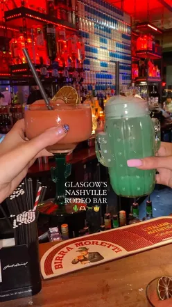 Cocktails and live music at Rodeo Bar in Glasgow, featuring bull riding and line dancing for a unique night out.